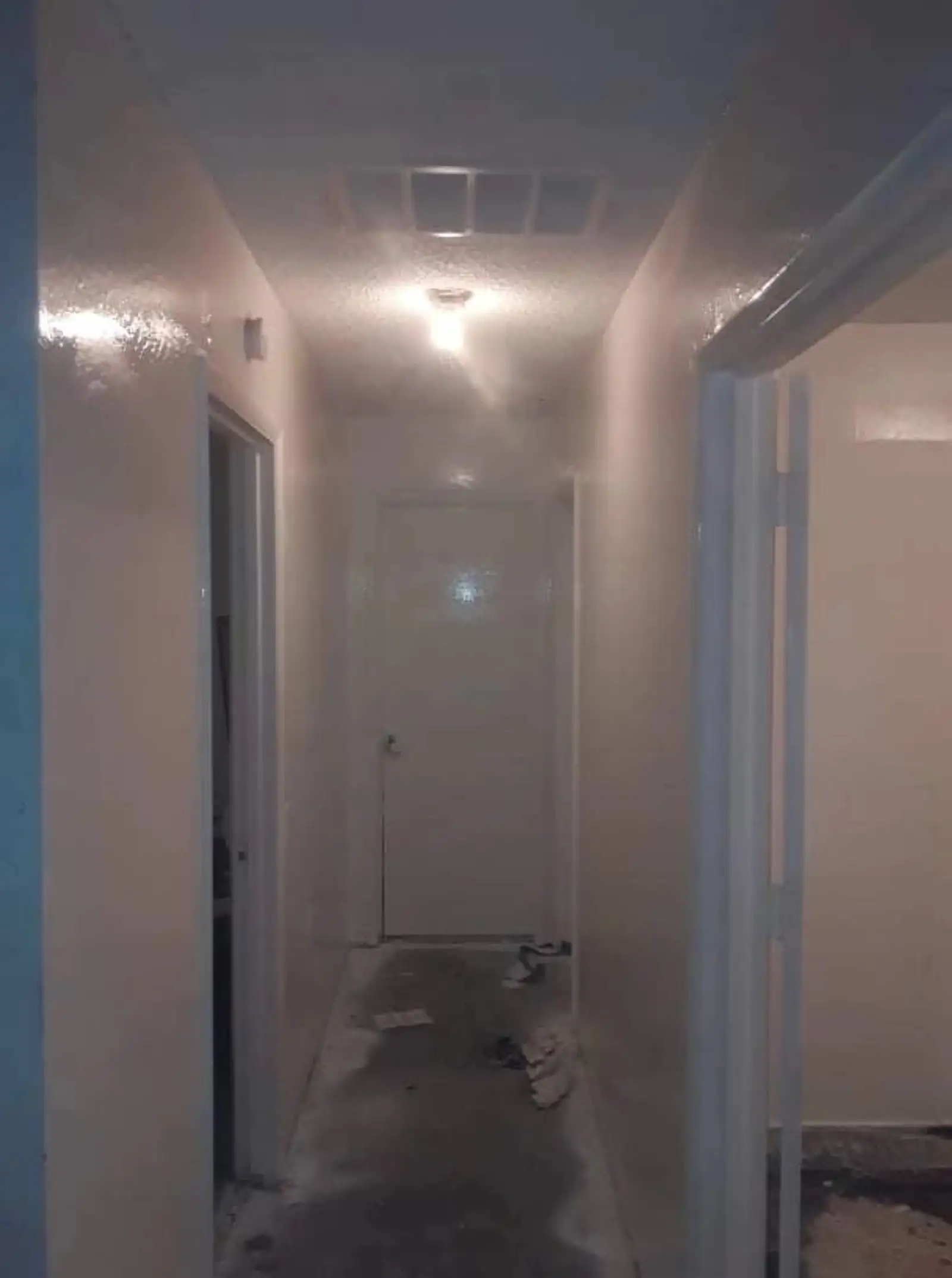 Unfinished interior corridor during the progress cleaning stage of construction