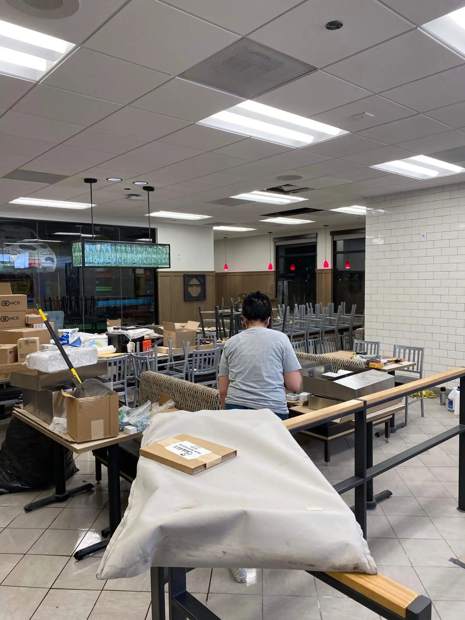 Habibi's crew members detailing a retail space around protected fixtures