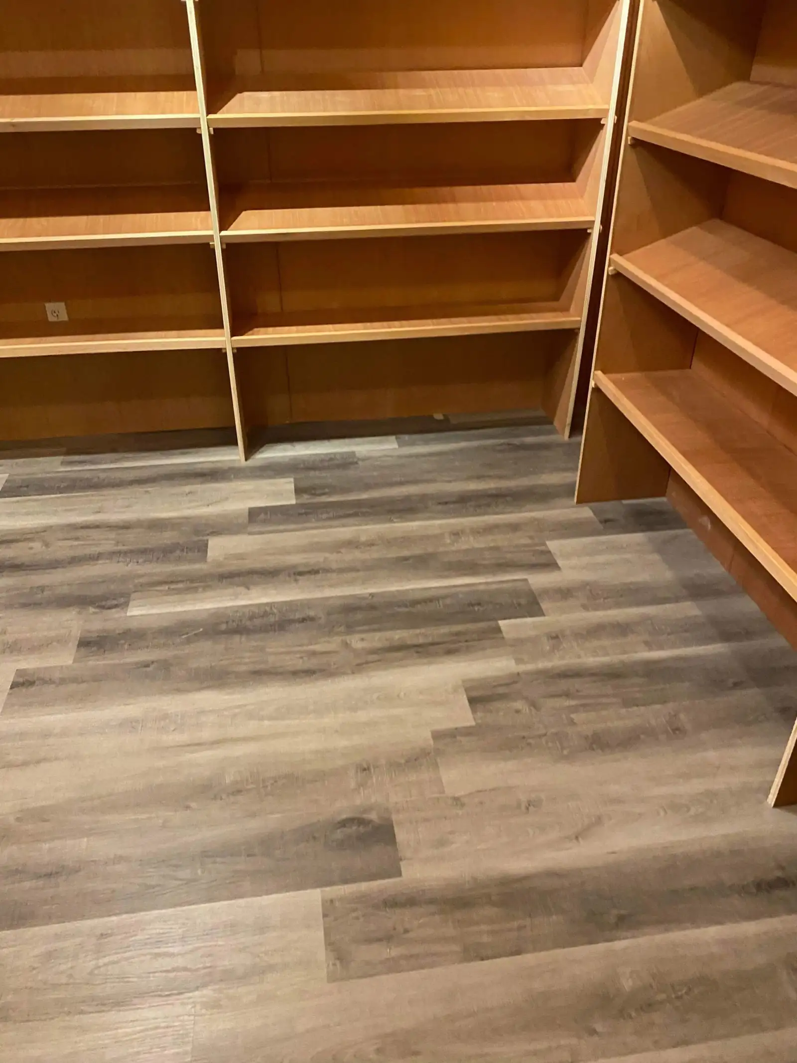 Newly installed retail shelving and flooring after a post-construction clean
