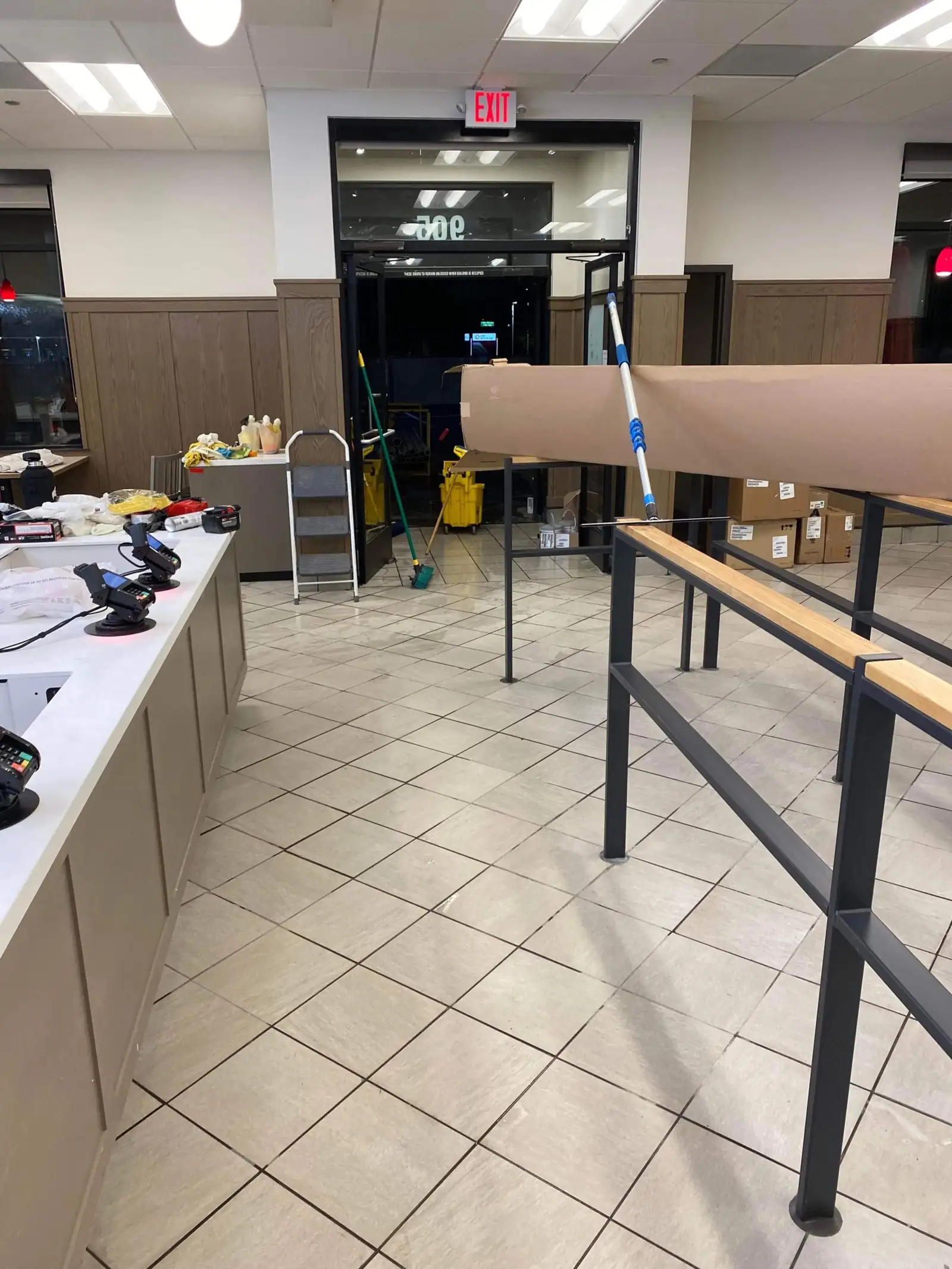 New retail fixtures and casework being cleaned during a post-construction final clean