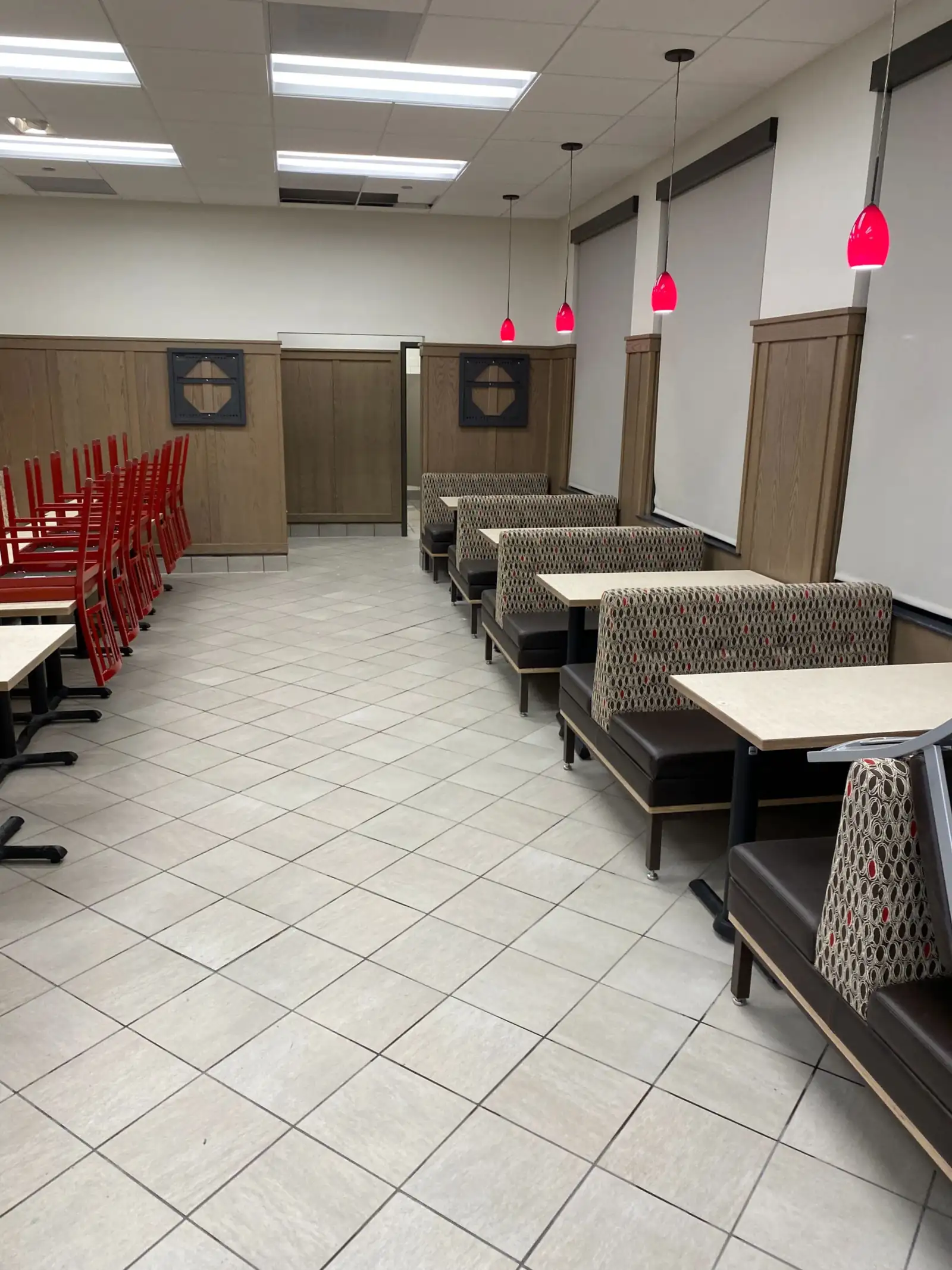 Restaurant booth seating and floors cleaned before opening