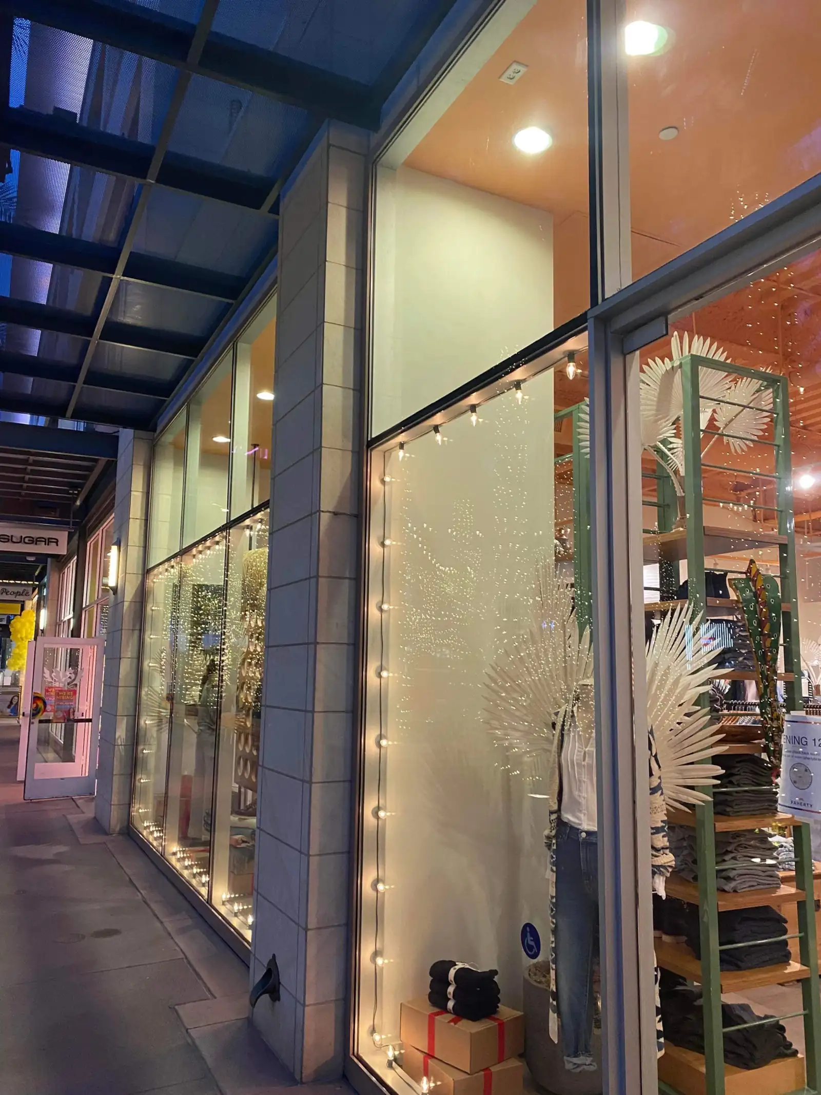 Commercial storefront glass at dusk after a window cleaning service